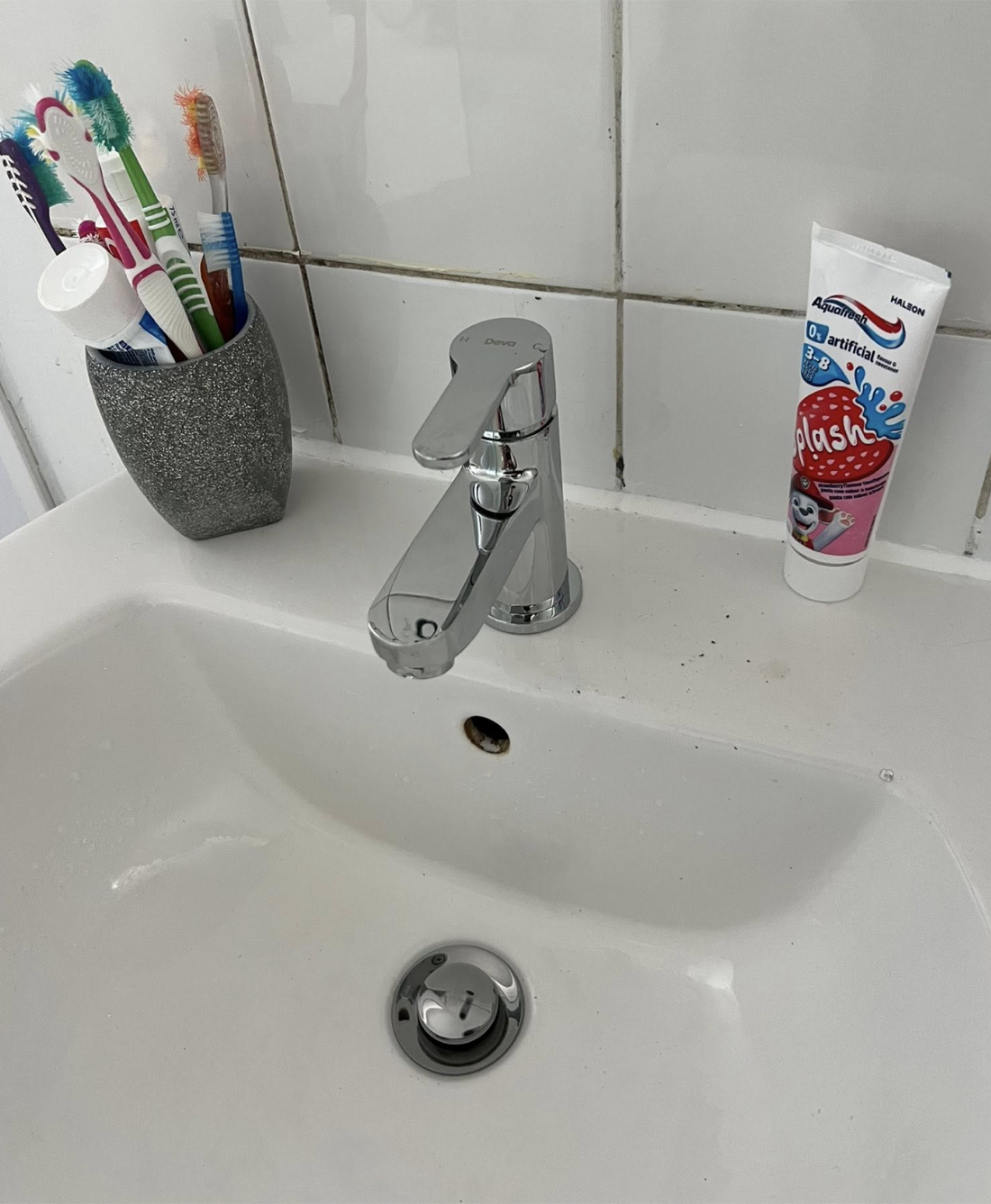 New chrome mixer tap neatly fitted to the same basin